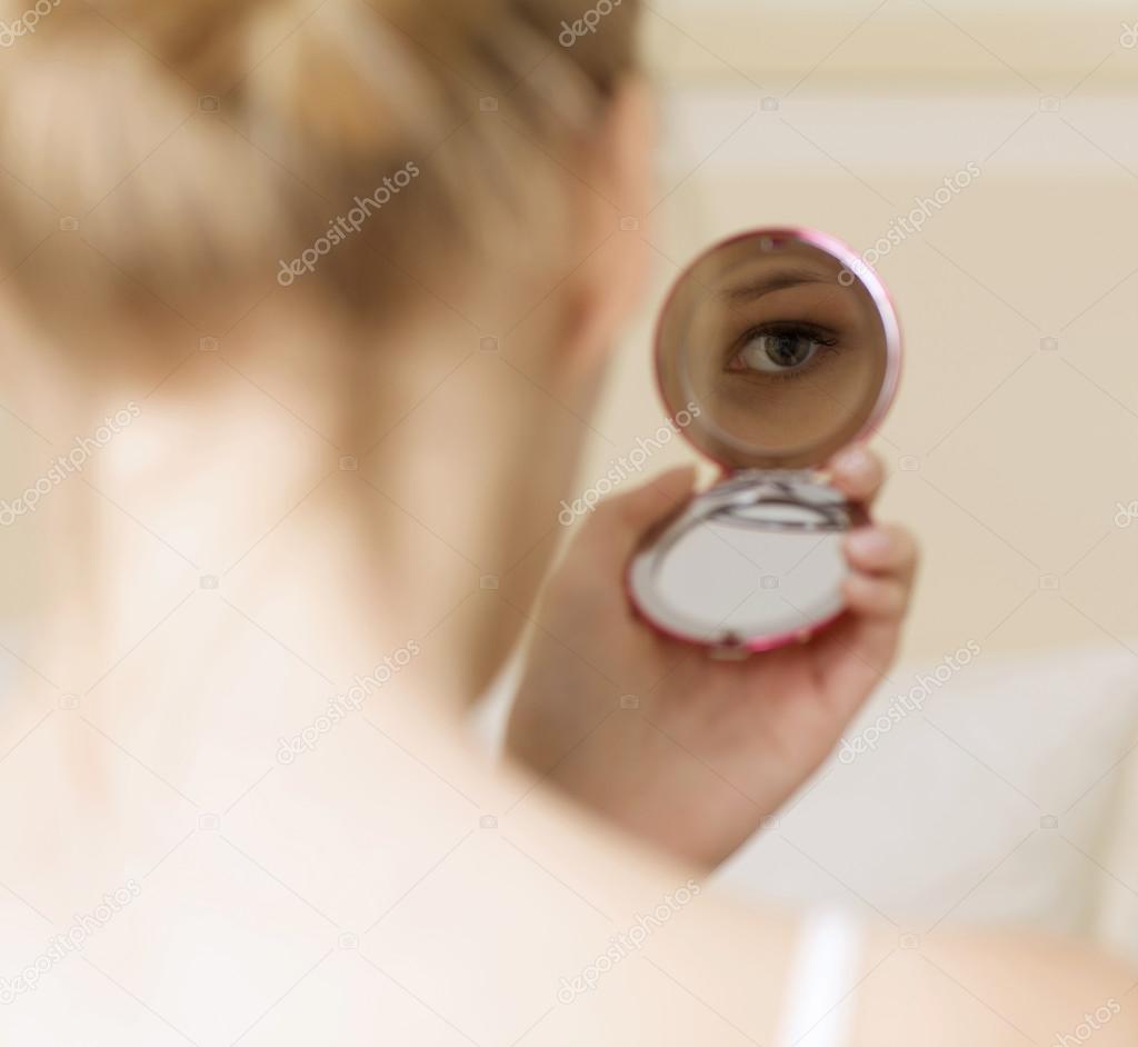 Woman reflection in mirror