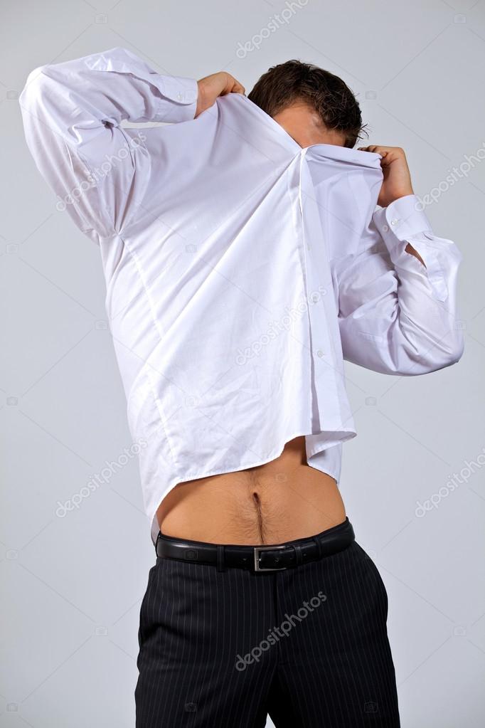 Businessman removing shirt