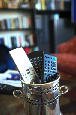 TV remote controls in box clipart