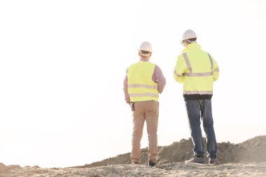 architects standing at construction site clipart