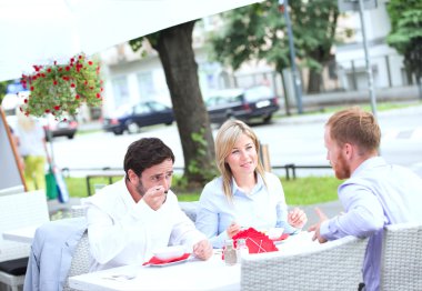 Businesspeople having food