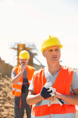 worker standing at construction clipart