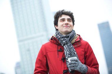 man in warm clothing looking away