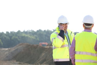 Supervisor using mobile phone