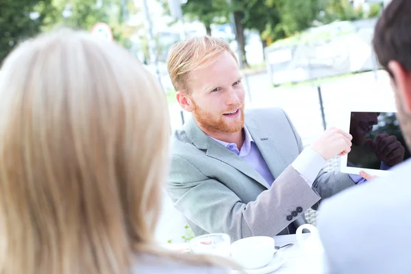 Businessman discussing over digital tablet — Stock Photo, Image
