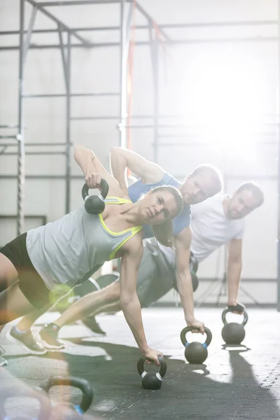 People exercising in crossfit gym — Stok fotoğraf