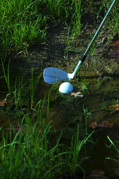 Chipping ball from hazard — Stock Photo, Image