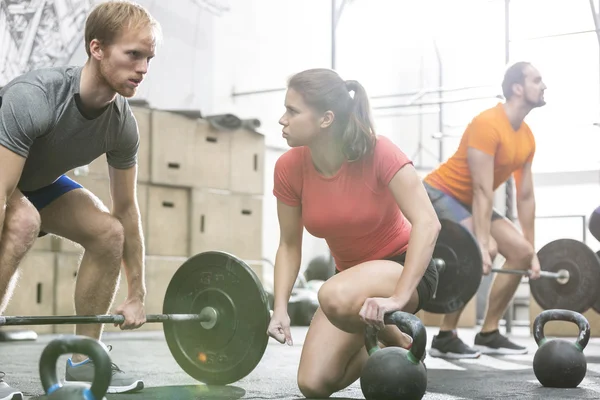 People weightlifting in  gym — Stok fotoğraf