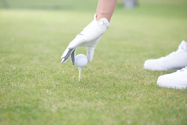 Woman placing ball — Stok fotoğraf