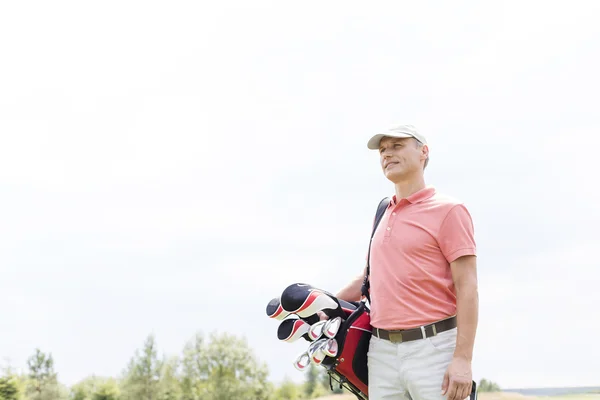 Middle-aged golfer looking away — 스톡 사진