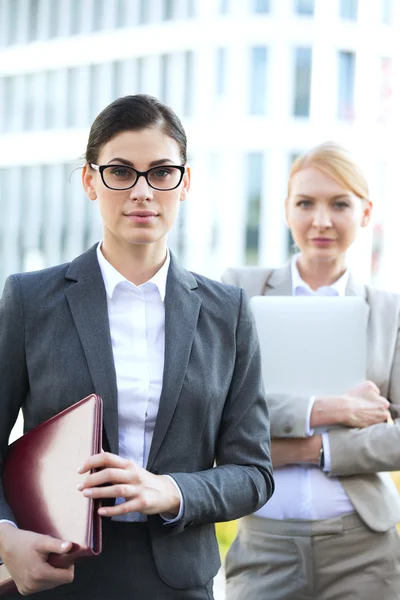 Confident businesswoman holding folder — Stok fotoğraf