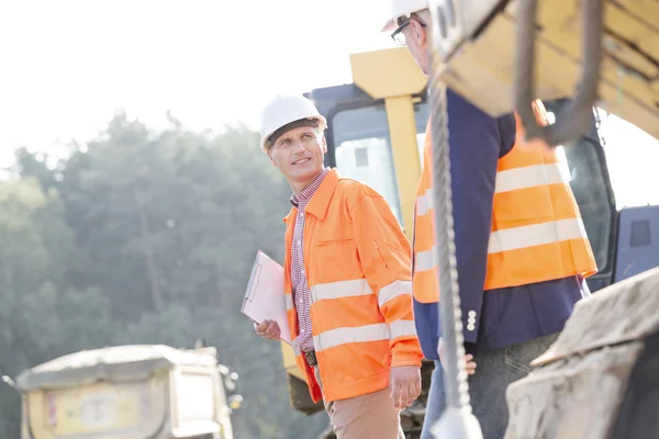 Supervisors discussing while walking — Stock Photo, Image