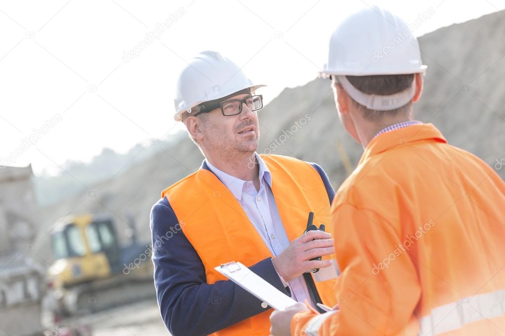 Architects discussing at construction site