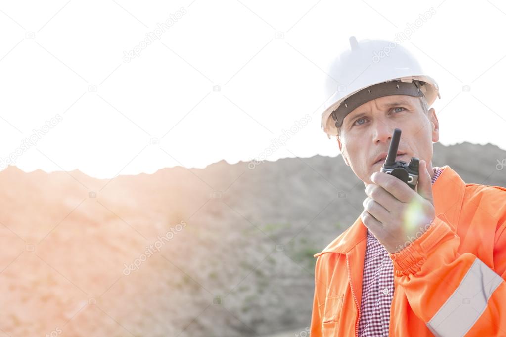 supervisor using walkie-talkie