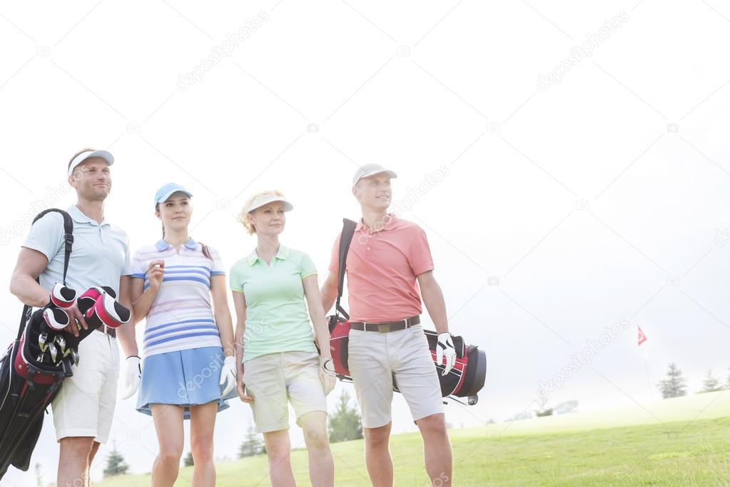 friends standing at golf course