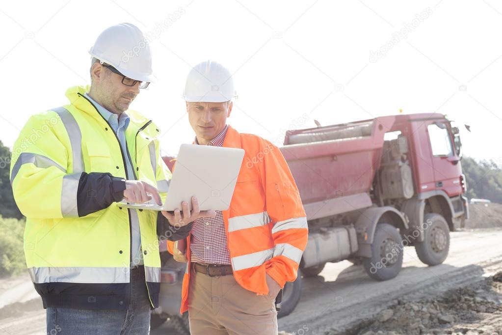 Engineers using laptop