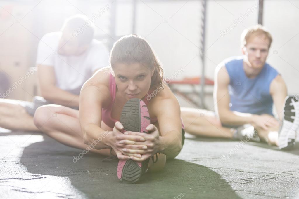 woman exercising in crossfit gym