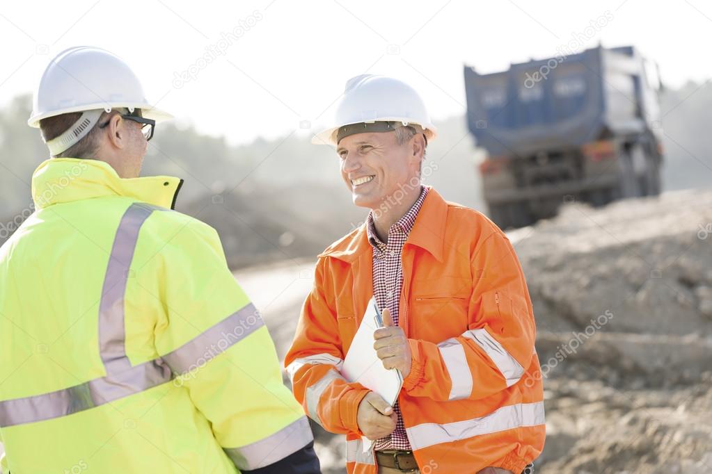 engineer discussing with colleague