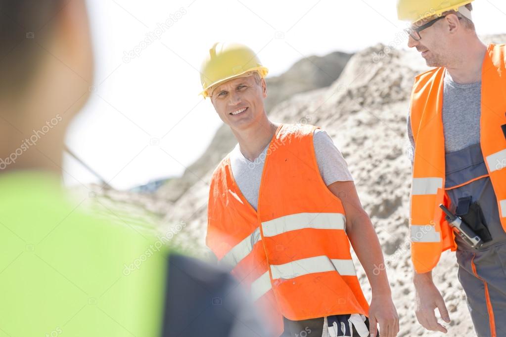 supervisor with colleague at construction site