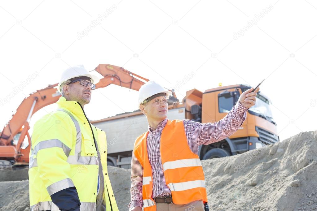Engineer showing something to colleague