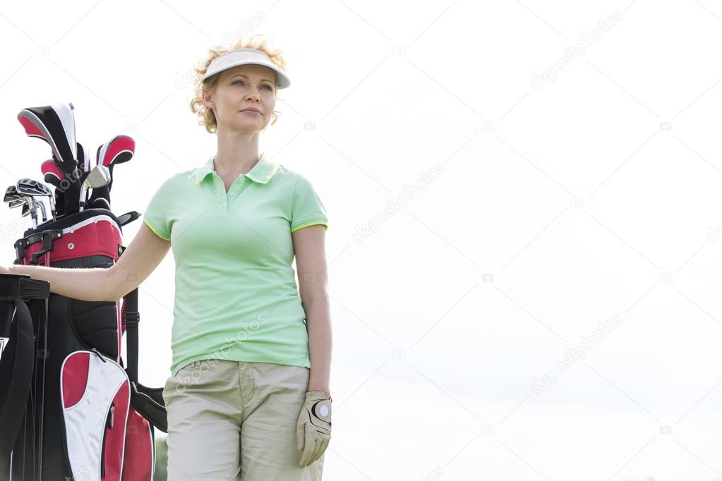 female golfer standing