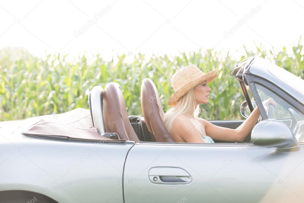 woman driving convertible