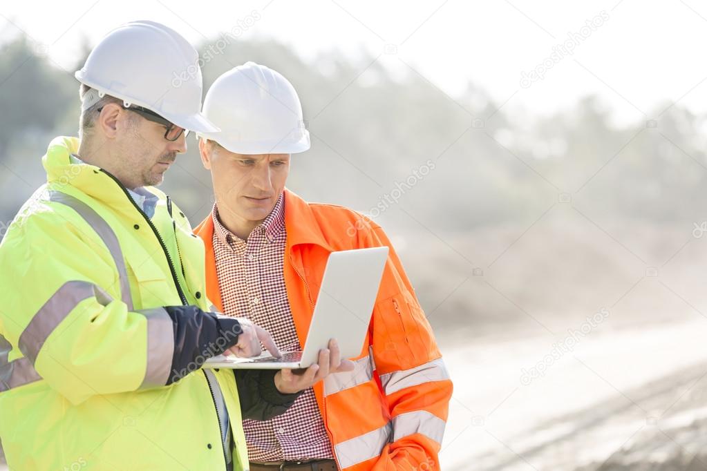 Supervisors using laptop