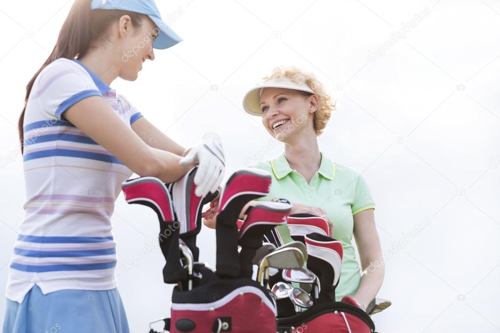 female golfers talking