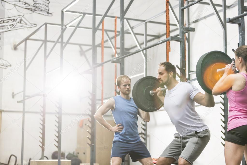 man in lifting barbell