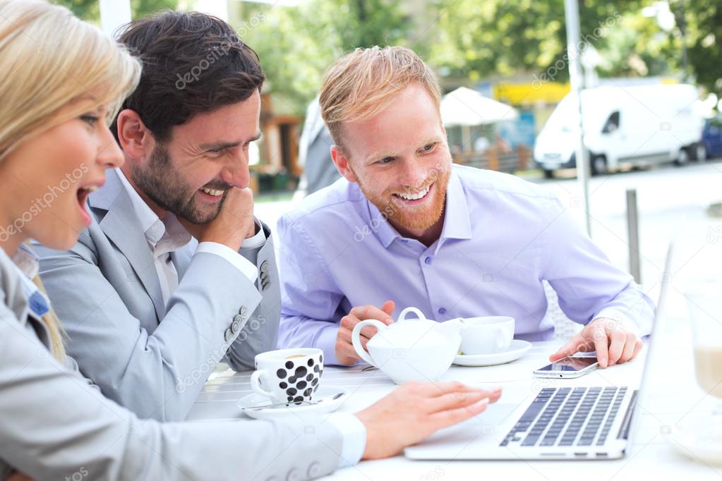 businesspeople using laptop