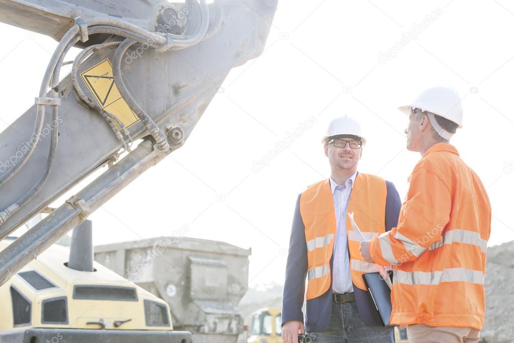 engineers discussing at construction site