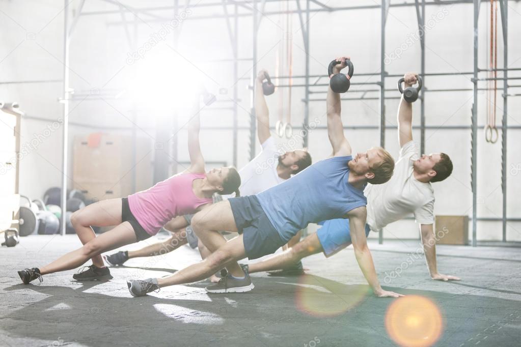 People exercising with kettlebells