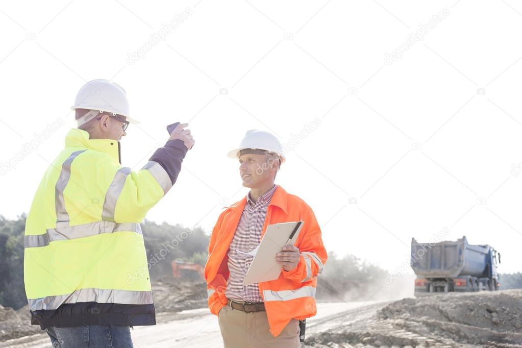 Supervisors discussing at construction site