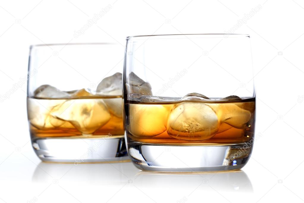 Glasses of whisky with ice