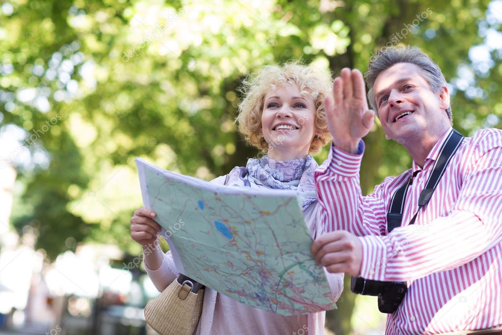 couple holding map
