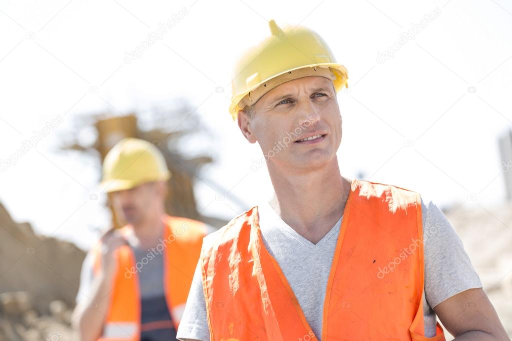 worker  with colleague standing
