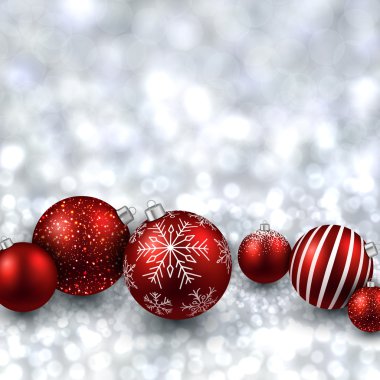Gümüş arka plan kırmızı Noel topları ile.