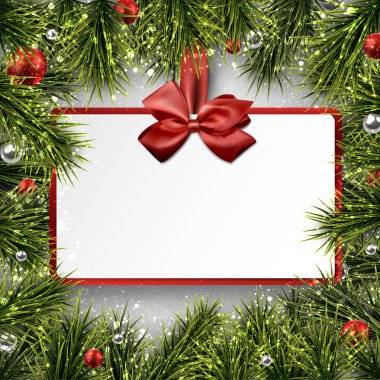 Kağıt hediye kartı çam dalları ile çerçeve üzerinde.