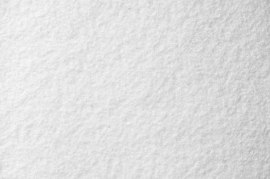 Yumuşak, bulanık ve lifli yüzeyini gösteren beyaz keçeli kumaşın makro görüntüsü, zanaat, tekstil veya tasarım amaçları için idealdir..