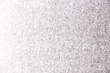 Beyaz kağıda siyah basılmış yarım tonlu nokta deseninin makro görüntüsü, yavaş yavaş soldan sağa doğru aydınlıktan karanlığa dönüşüyor..