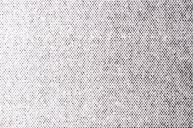 Yarım tonluk bir nokta deseninin makro fotoğrafı yavaş yavaş yoğunluğu ışıktan karanlığa kayıyor, beyaz kağıda siyah mürekkeple basılıyor..