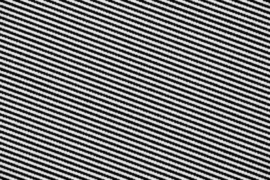 Kağıda basılmış dalgalı köşegen siyah ve beyaz çizgilerin makro fotoğrafı mürekkep kanamasını ve düzensiz kenarları ince detaylarıyla ortaya çıkarıyor..