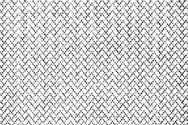 Son derece yakın plan baskılı siyah noktalar beyaz kağıt üzerinde zigzag deseni oluşturuyor, makro mercekle çekiliyor..