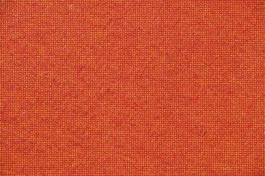 Son derece yakın plan basılmış kağıtta kırmızı ve sarı tonlarda ince CMYK noktaları var. Yoğun bir yarım ton deseni oluşturuyor..