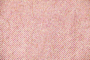 Yoğun morumsu CMYK yarım ton noktalarıyla dolu lifli ışık kağıdının aşırı yakın çekimi yumuşak, çok renkli benekli bir yüzey yaratıyor..