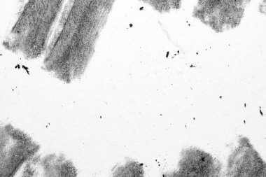 Üst sol ve üst köşesinde yumuşak kömür blokları olan yüksek tuşlu tek renkli kağıt dokusu, artı alttaki koyu lekeler.