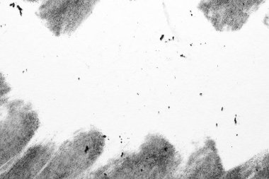 Kenarlarında yumuşak kömür yamaları, dağınık toz zerreleri ve ışık lekeleri olan en az siyah ve beyaz kağıt makrosu. Tasarım için geniş kopya alanına sahip soyut arkaplan.