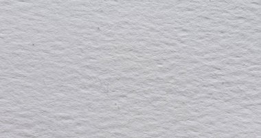 İnce doğal tahıllı ve yumuşak desenli yüzeyi olan beyaz suluboya kağıdın yakın çekimi, resim, kırtasiye, modelleme ve tasarım kullanımı için ideal..