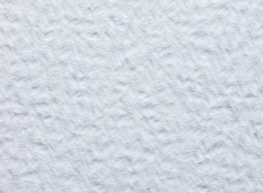 Kabartmalı kabartmalı dokuya ve ince lifli detaylara sahip beyaz çizim kağıdının makro yakın çekimi. Sanat, kırtasiye, baskı ve minimalist tasarım kullanımı için temiz bir arkaplan ideali.