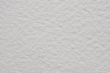 Beyaz suluboya kağıda yakın plan, ince doğal tahıllı ve yumuşak desenli yüzey, resim, kırtasiye, modelleme ve tasarım kullanımı için ideal..